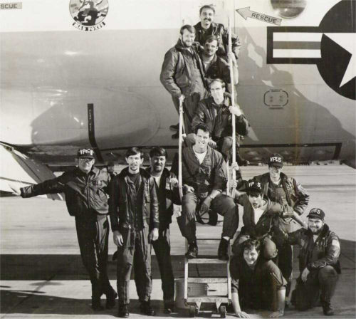 Photo of Navy Captain Bill Diman, W2WLD, (top) and his crew with their P-3 Orion aircraft.