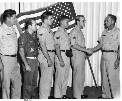 Photo of Don receiving an award at Castle AFB.